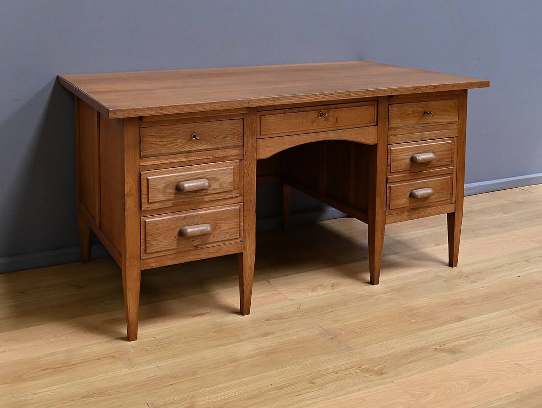 Solid oak pedestal desk, Régy establishments – 1940