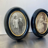 Pair of black wooden oval frames 1880’s  each 13 cm x 10 cm glass measurements 8.5 cm x 5.5 cm