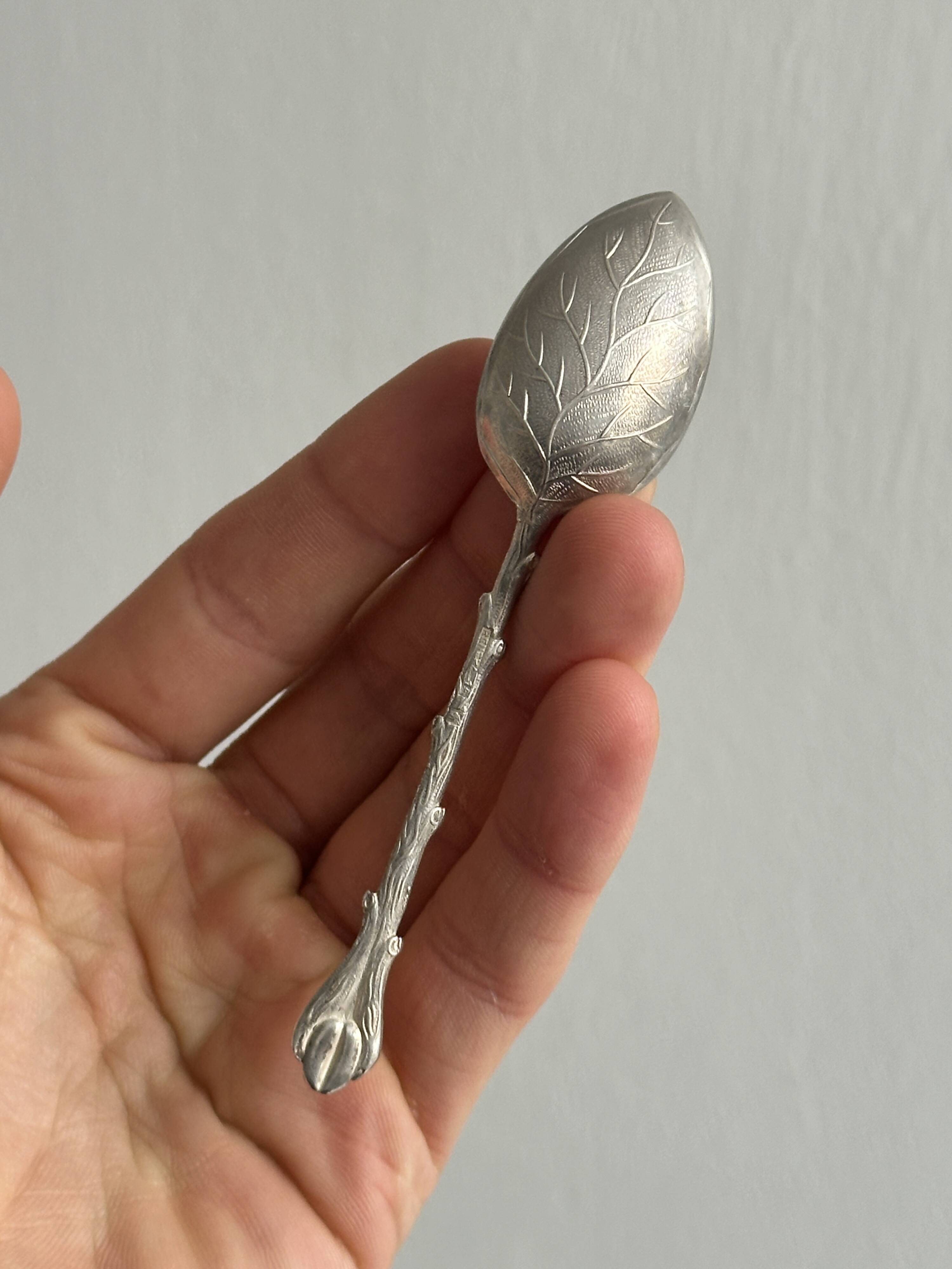 Set of 10 small silver metal spoons