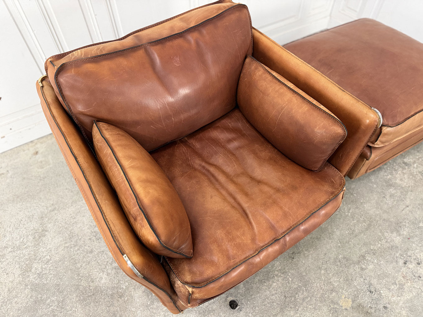 Club armchair and its ottoman 1980s