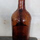 Bouteille à anse verre ambré