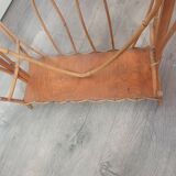 vintage rattan magazine rack with glass top, missing a rim of the magazine rack