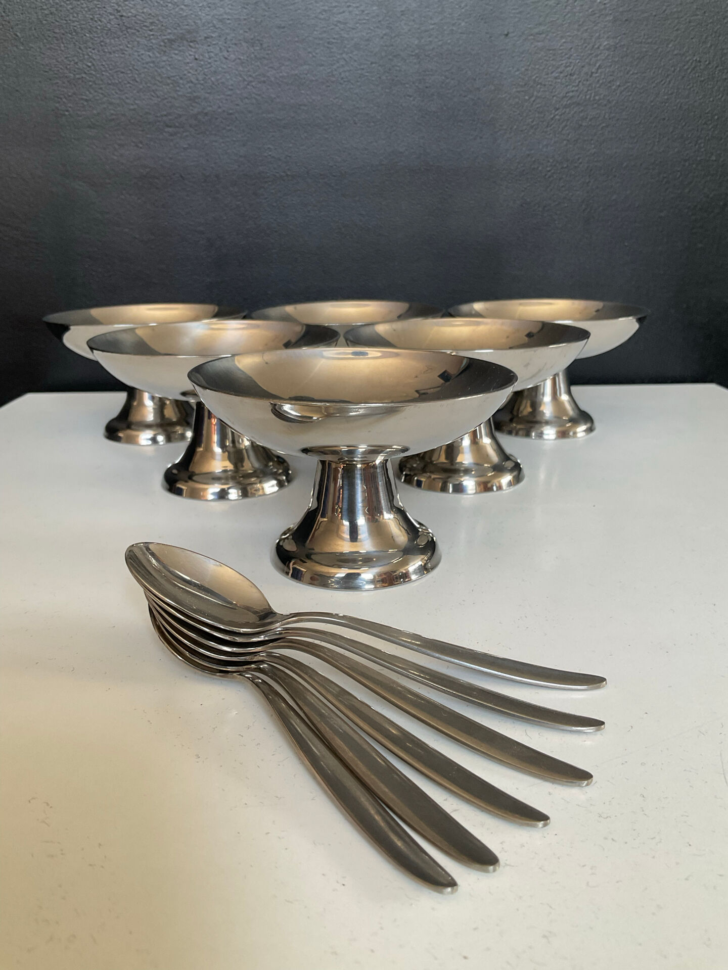 Set of 6 vintage stainless steel ice cream bowls with spoons.