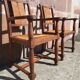 Pair of oak armchairs with straw seats and backs.