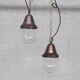 Pair of brass and clear glass industrial pendants
