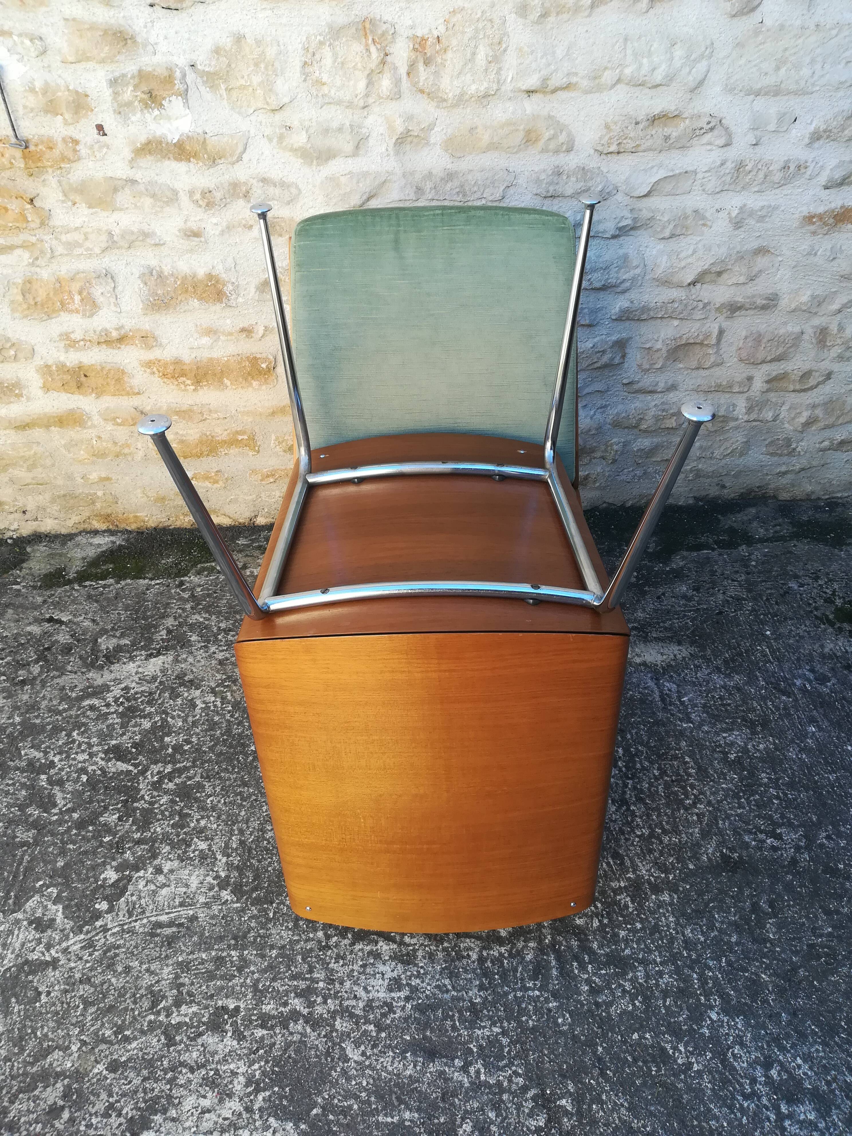 Shell chairs and green fabric