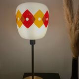 Table lamp with a vintage orange and red "Jacquard" globe in white glass and a golden base