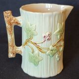 Old pitcher in slip 1900 ivy or holly decoration