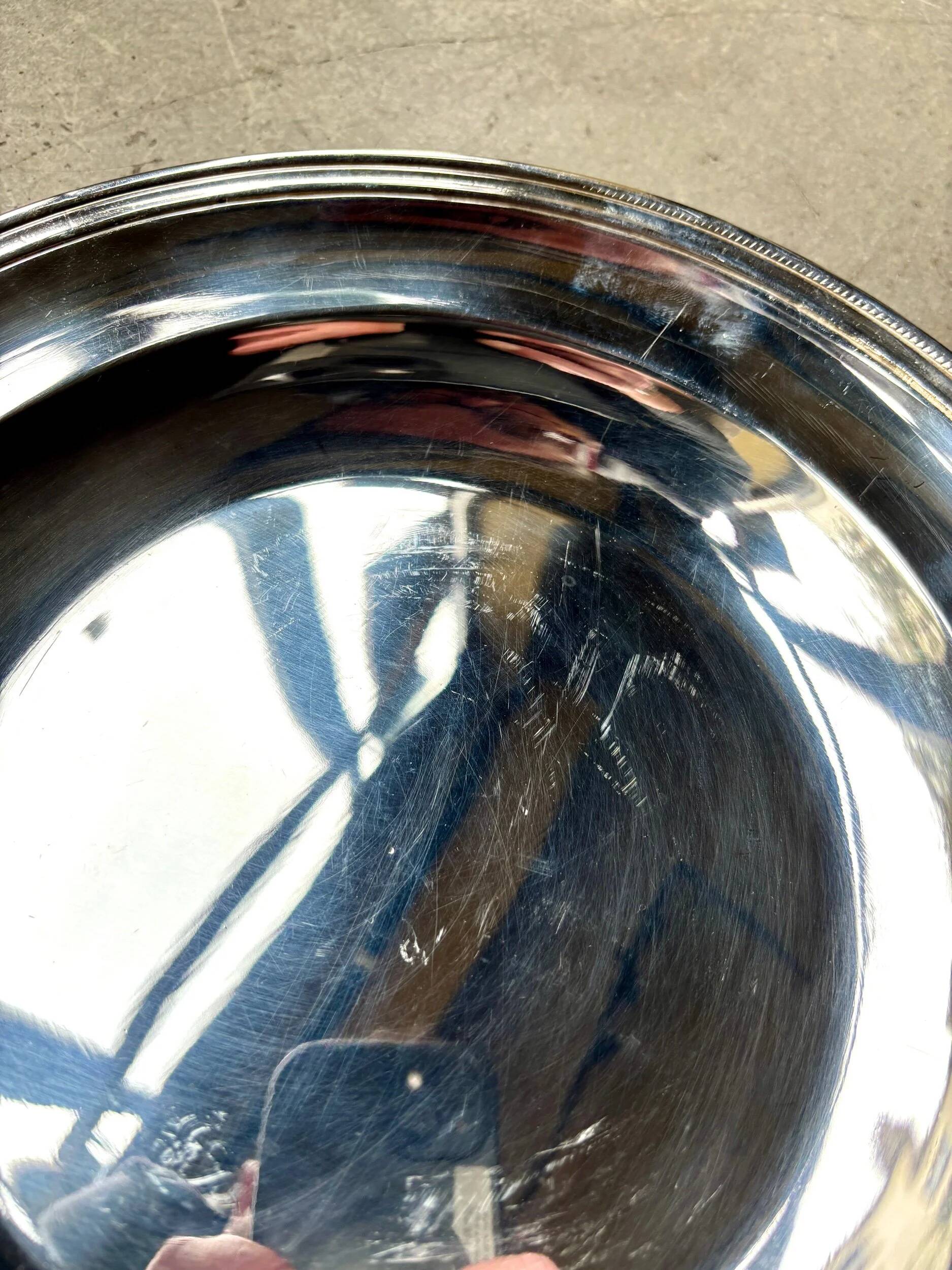 Round silver-plated metal dish