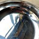 Round silver-plated metal dish