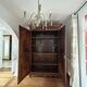 Antique walnut armoire with two doors.