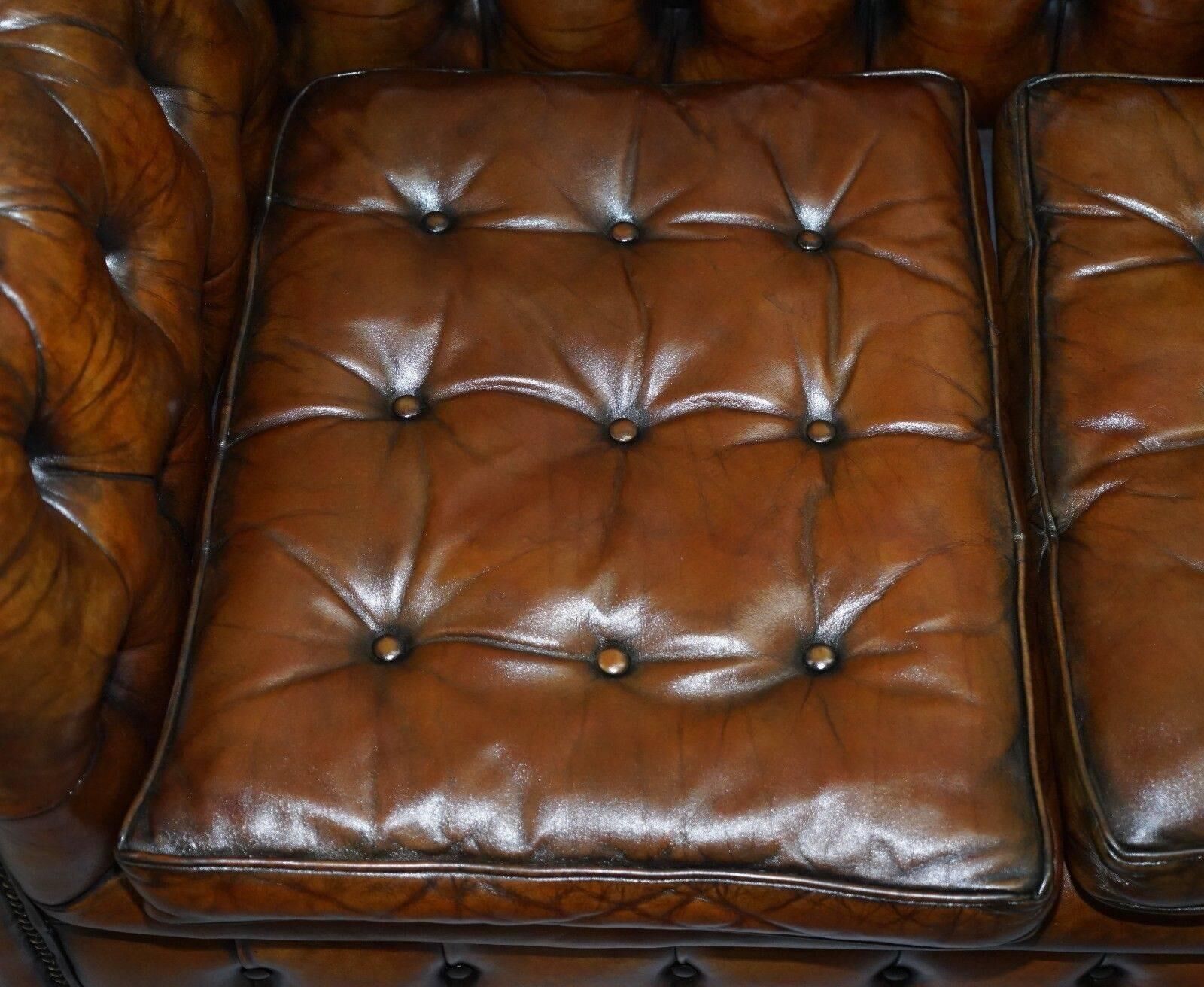 Restored vintage leather Chesterfield canapé in Thomas Chippendale style.