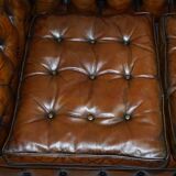 Restored vintage leather Chesterfield canapé in Thomas Chippendale style.