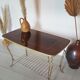 Table basse vintage en bois laqué et métal doré