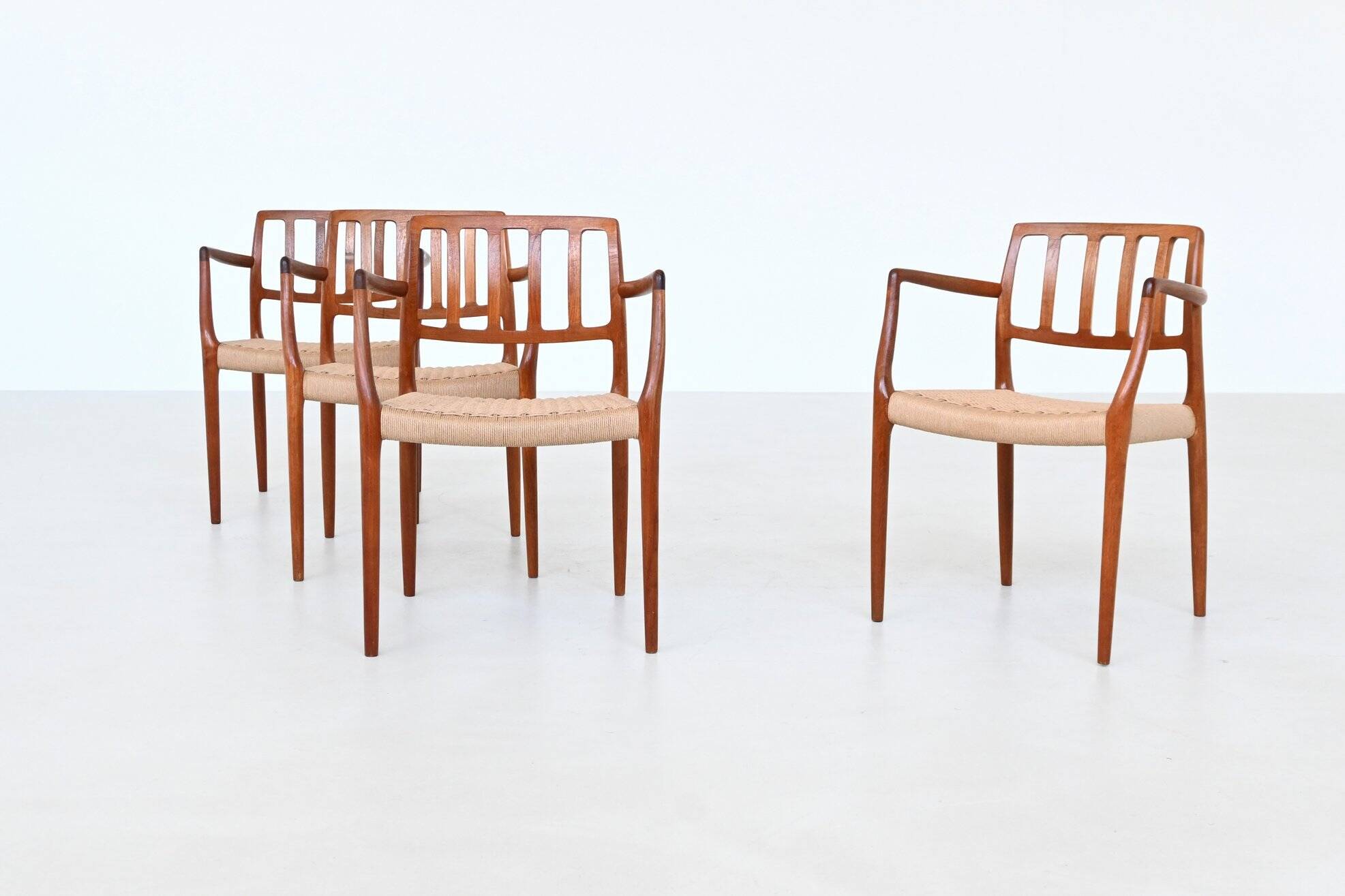 Niels Otto Moller model 66 armchairs teak and paper cord Denmark 1974