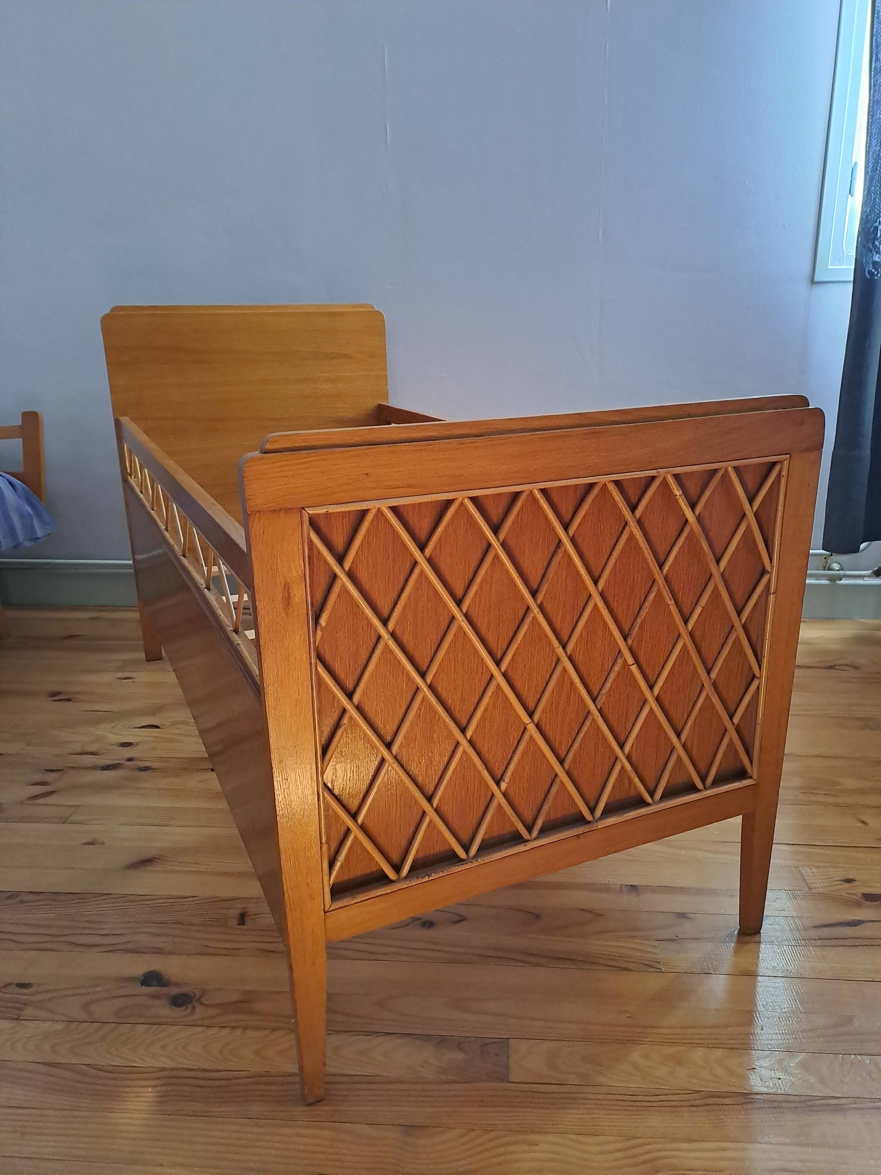Solid wood and rattan baby bed from the 1960s