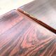 Rosewood dining table with integrated extensions — Denmark, 1960s