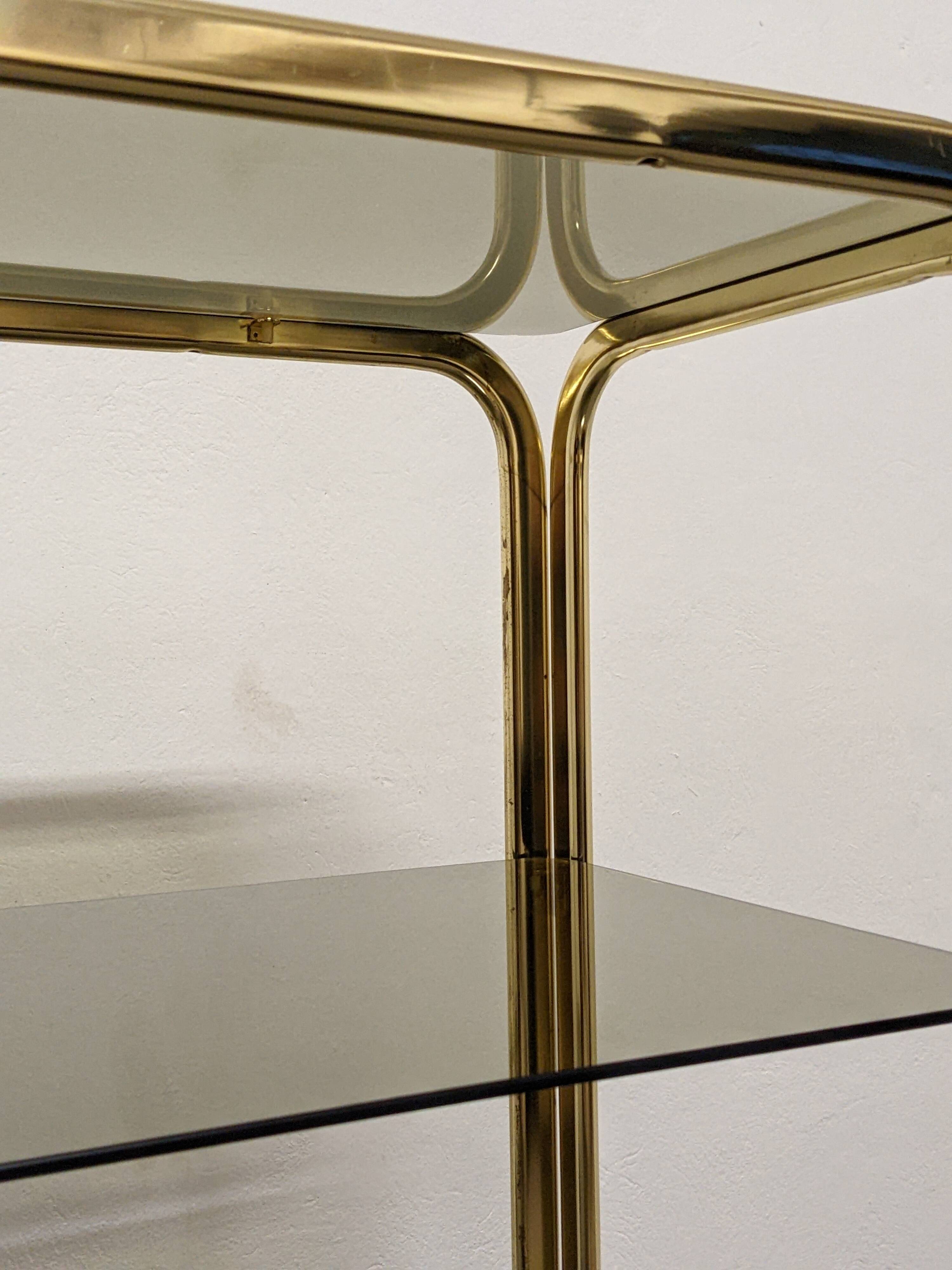 Hollywood Regency gilt metal and smoked glass shelf, Italy circa 1970