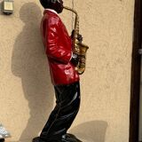 Large black and red jazz figurine in fibreglass, decorative sculpture from the 1960s.
