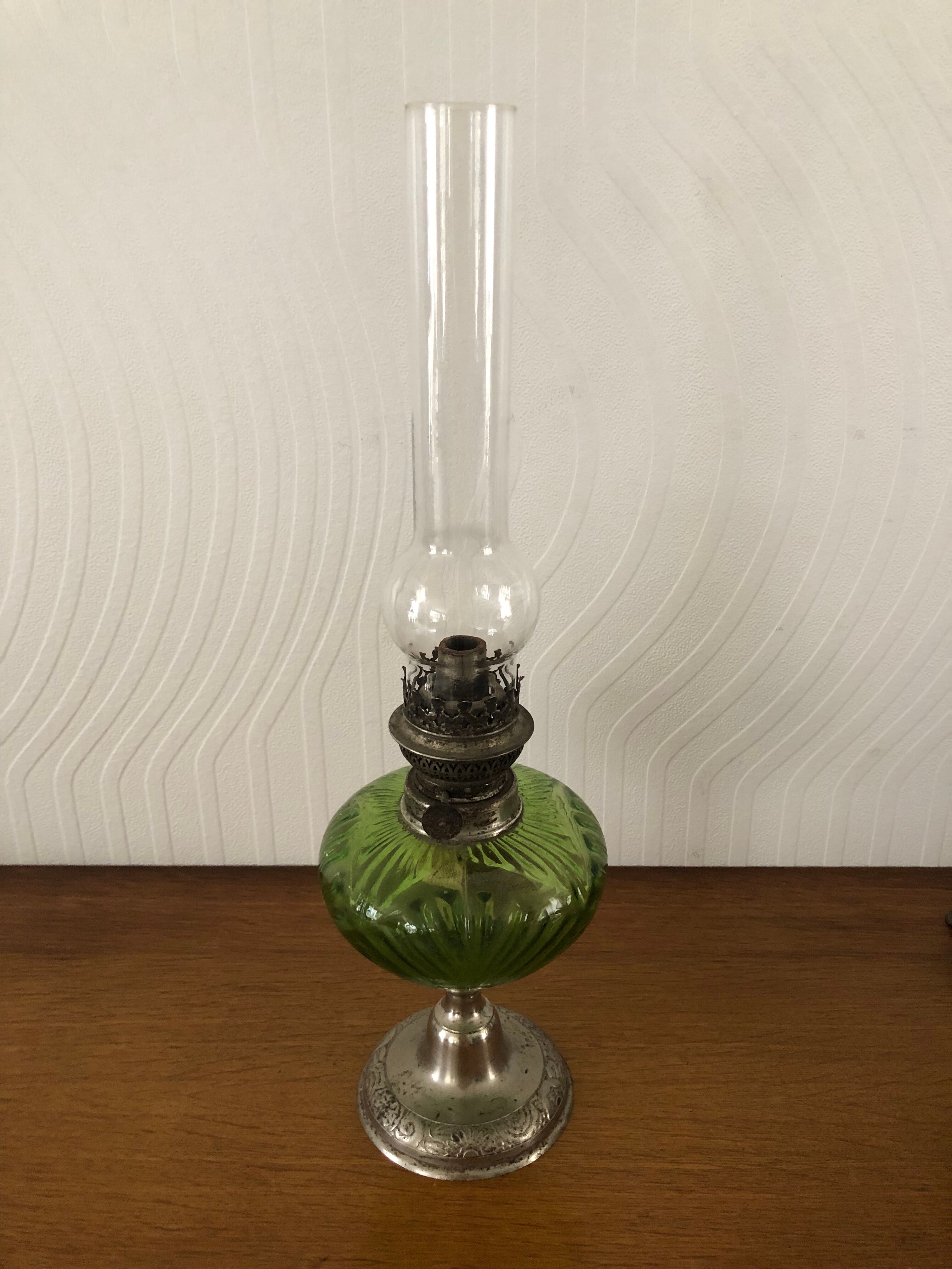 Antique oil lamp in glass and metal
