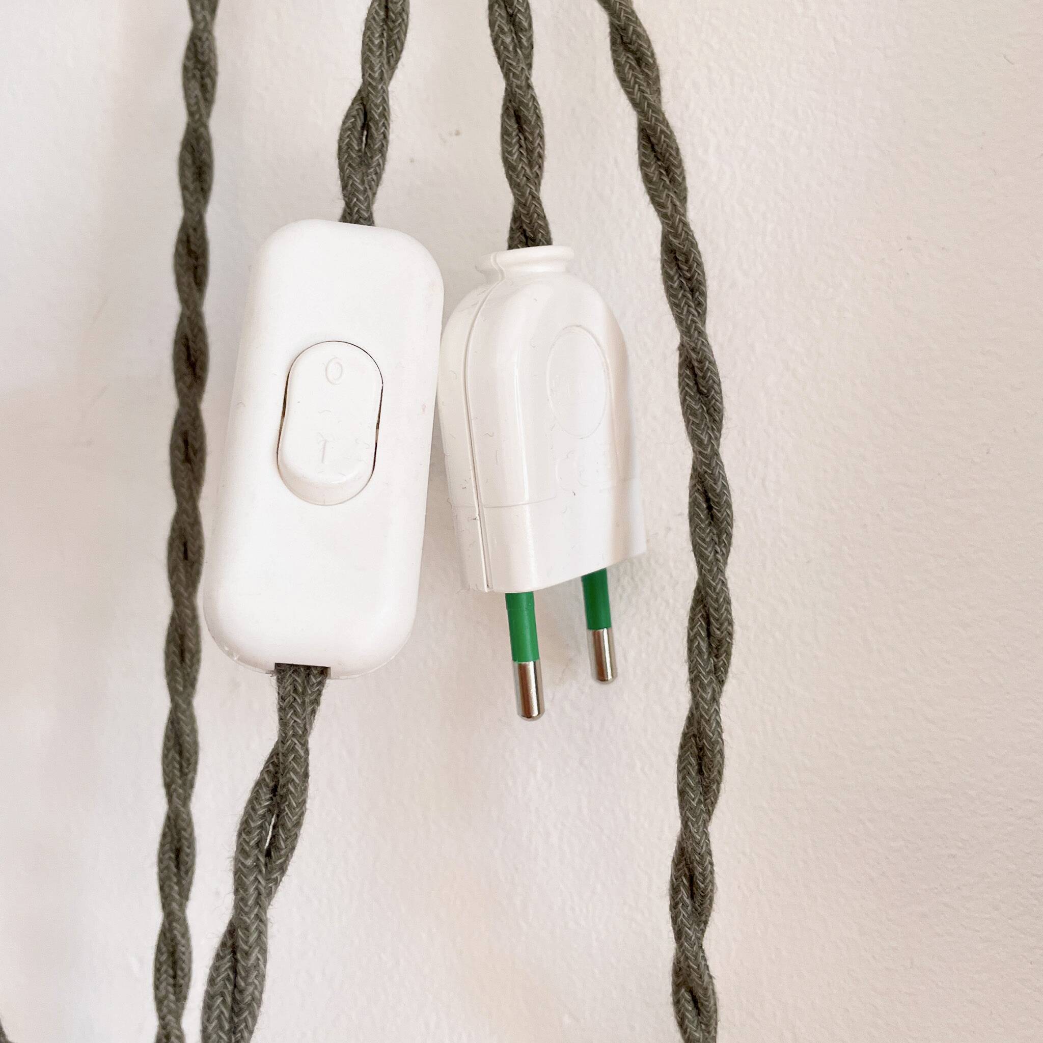 Wooden portable lamp with green cable