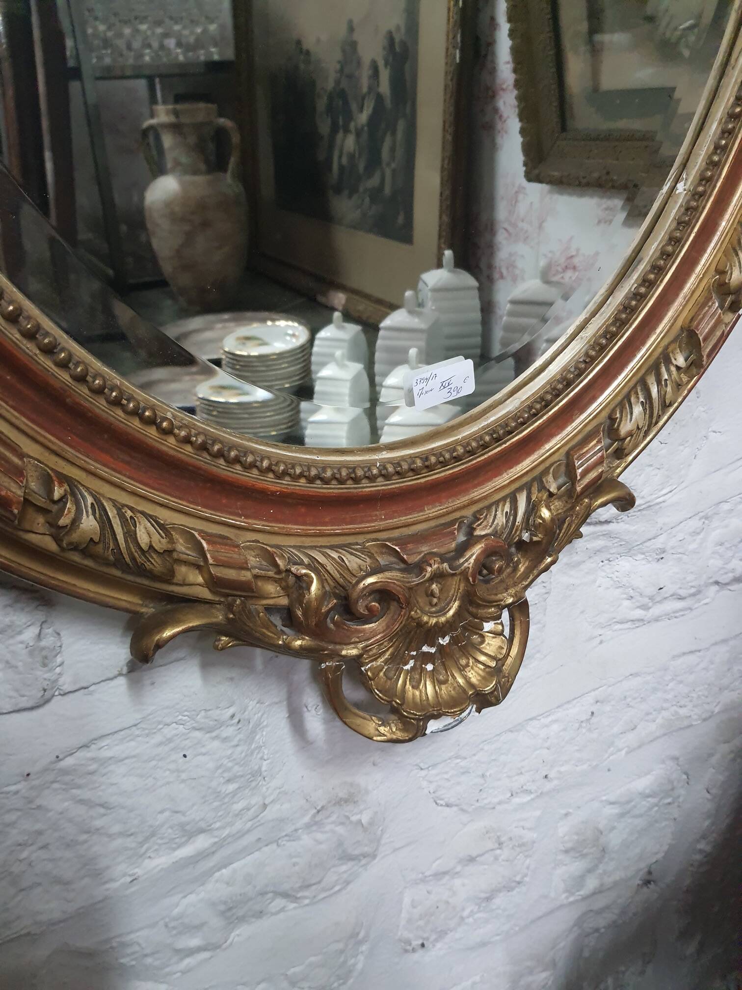 Golden oval mirror