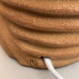 Oval table lamp in handcrafted ceramic with draped effect.