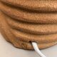 Oval table lamp in handcrafted ceramic with draped effect.
