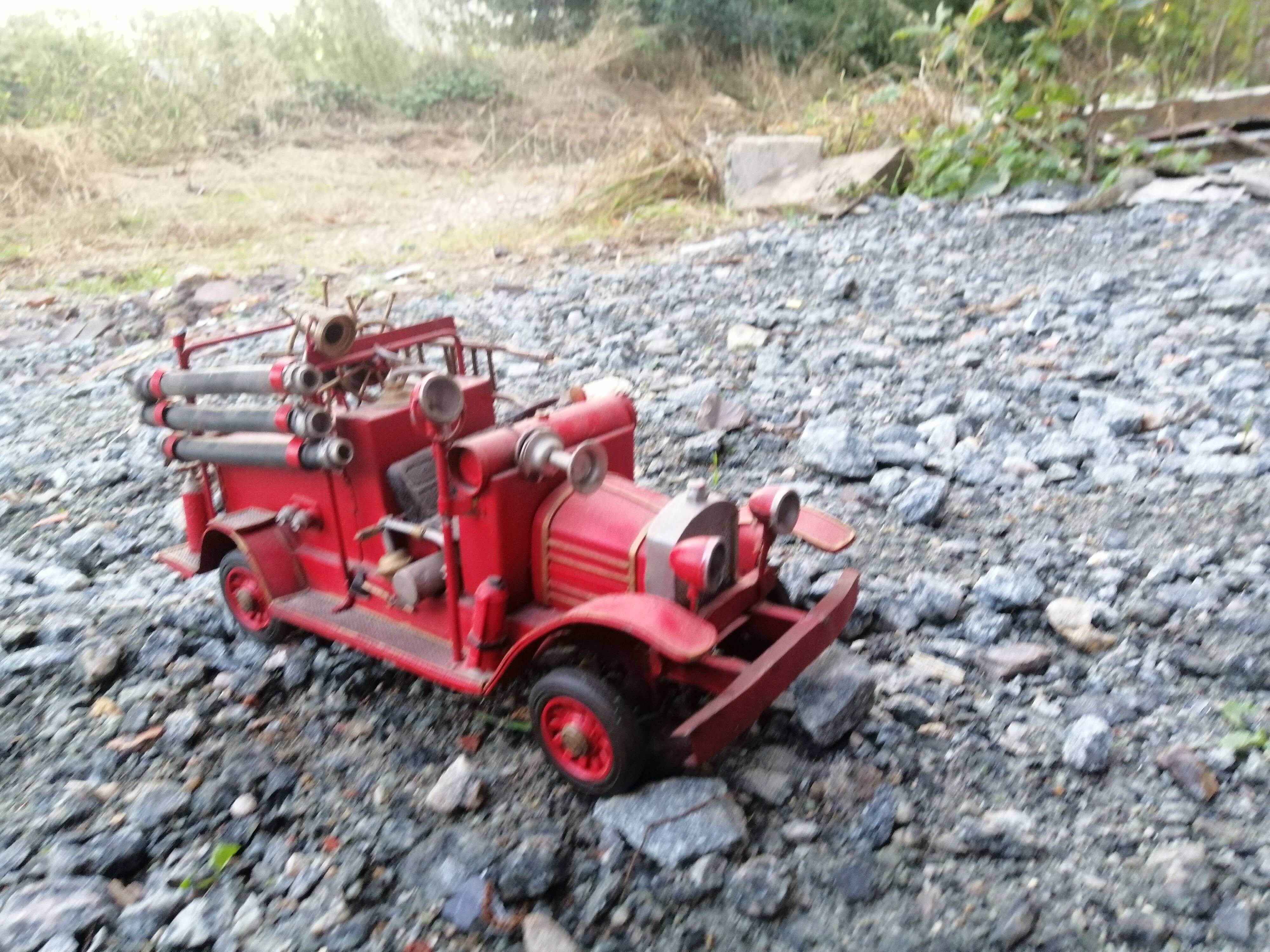 American fire truck from 1930 in sheet steel with all its water lance accessories,