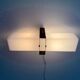 Simple white plexiglass wall light with a black metal frame, 1970s, Germany.