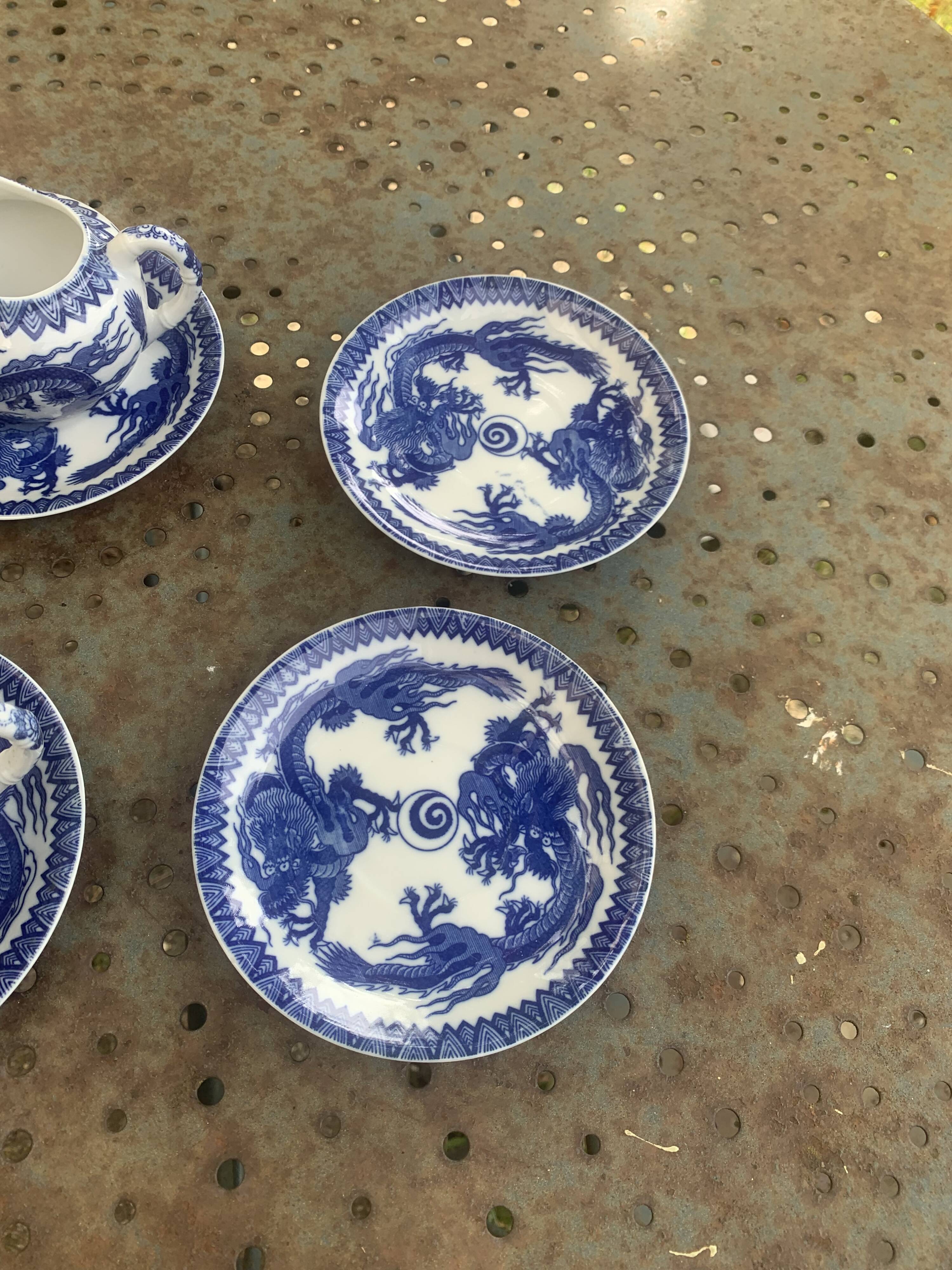 Porcelain tea set with dragon or cherry blossom motif