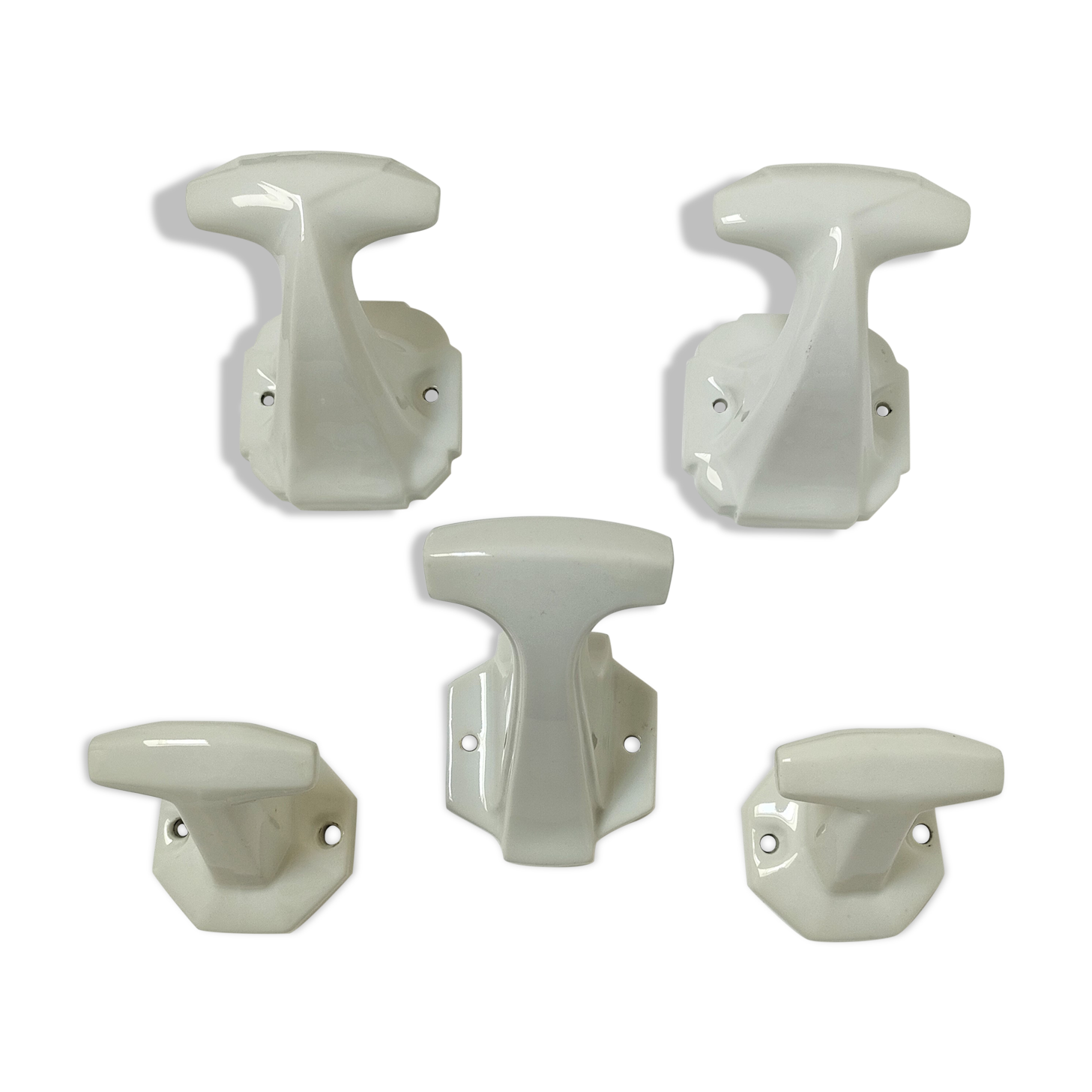 Five art deco white porcelain hooks