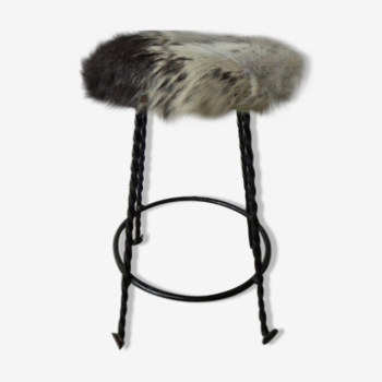 Vintage stool lined with cowhide