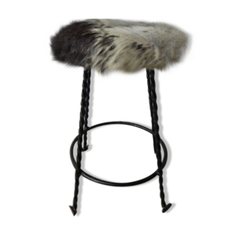 Vintage stool lined with cowhide