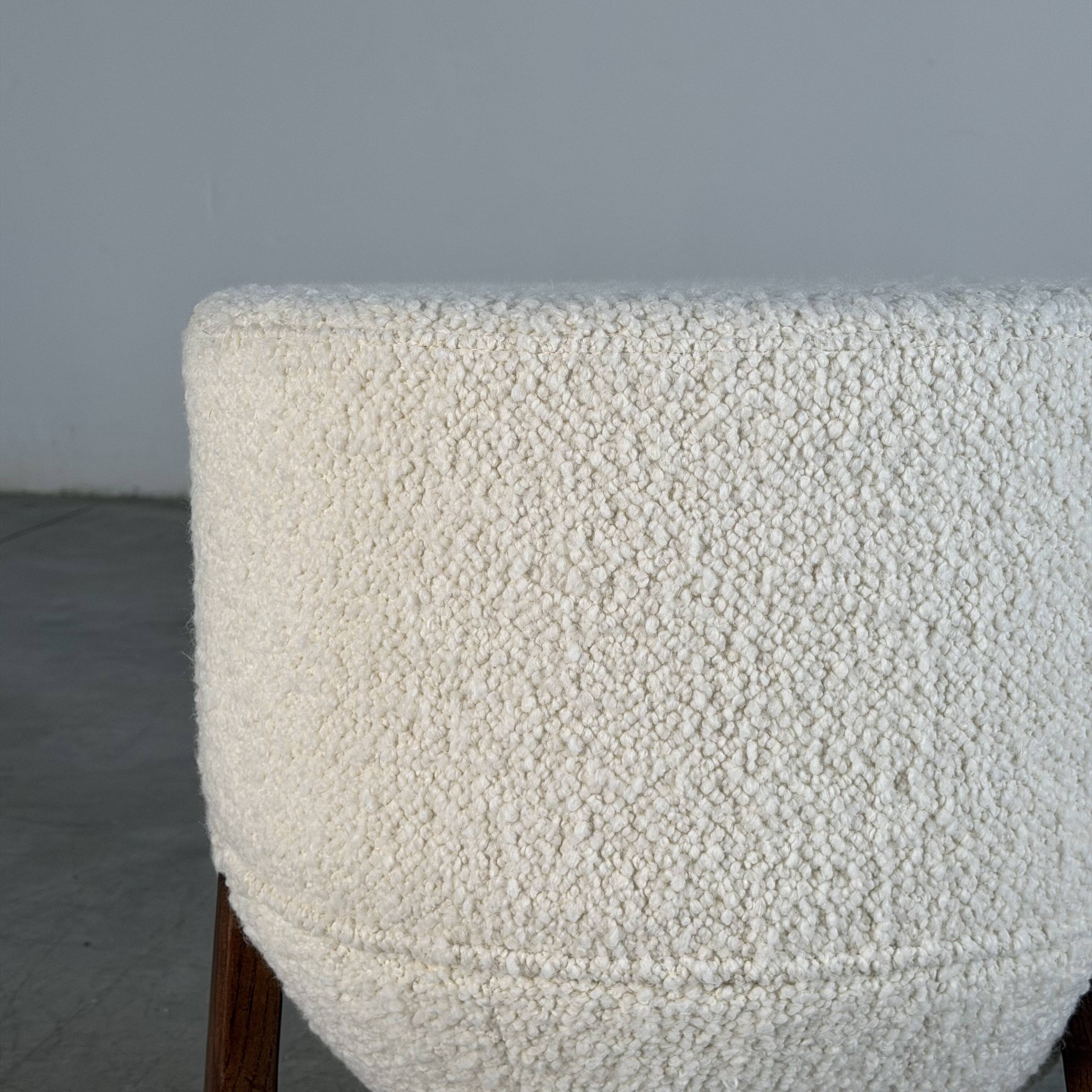 TOTEMO stools by FORME with ivory Dedar bouclé upholstery and walnut legs.