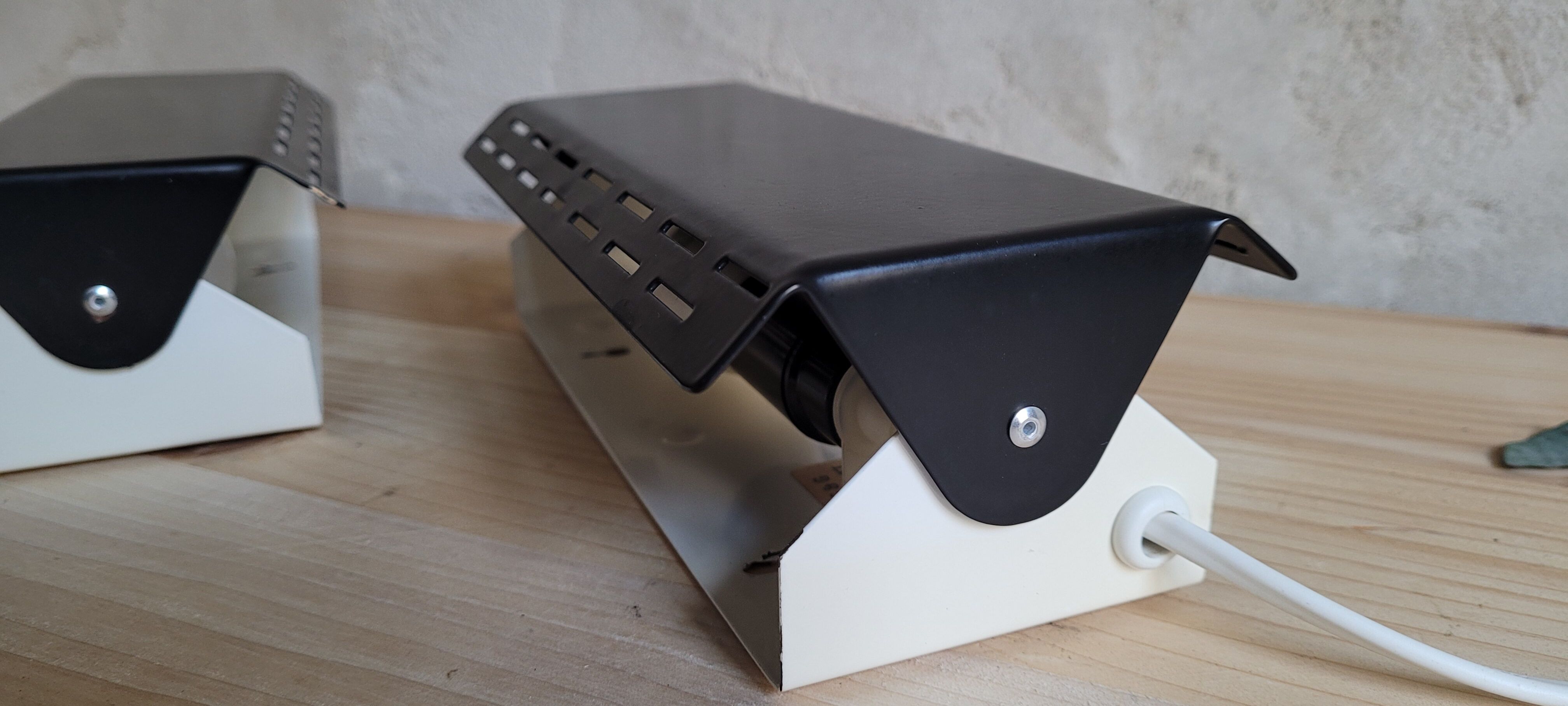 Pair of wall sconces with adjustable shutter