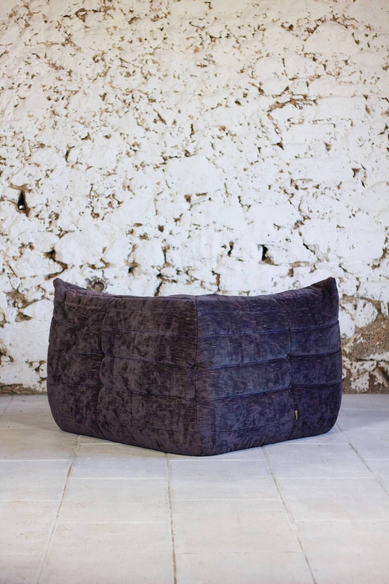 Togo aubergine corner armchair by Michel Ducaroy for Ligne Roset