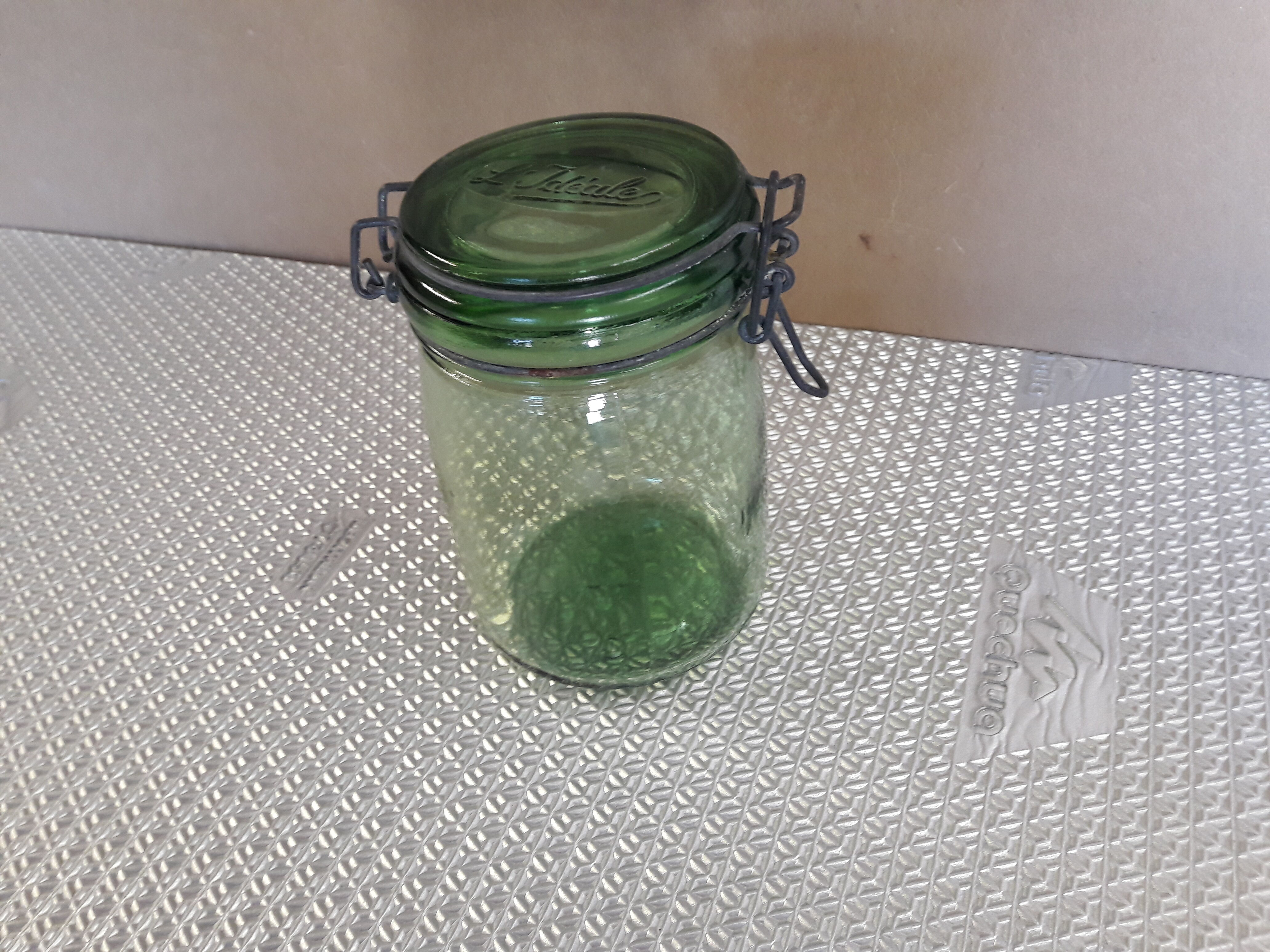 Green glass jar l l 'ideal