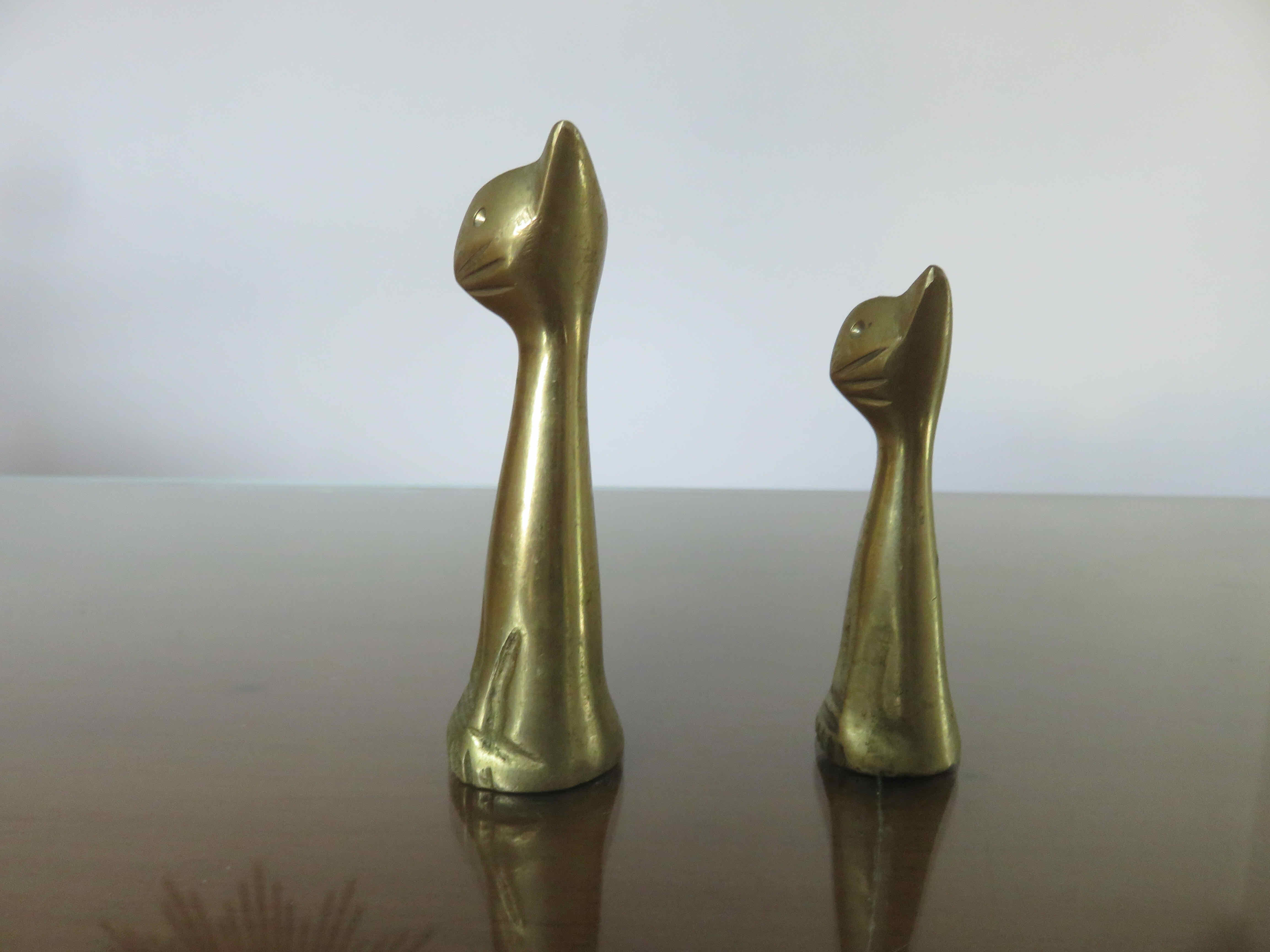 Couple of stylized cats in brass 70s