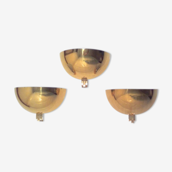 Three brass and lucite wall lights