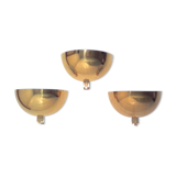 Three brass and lucite wall lights