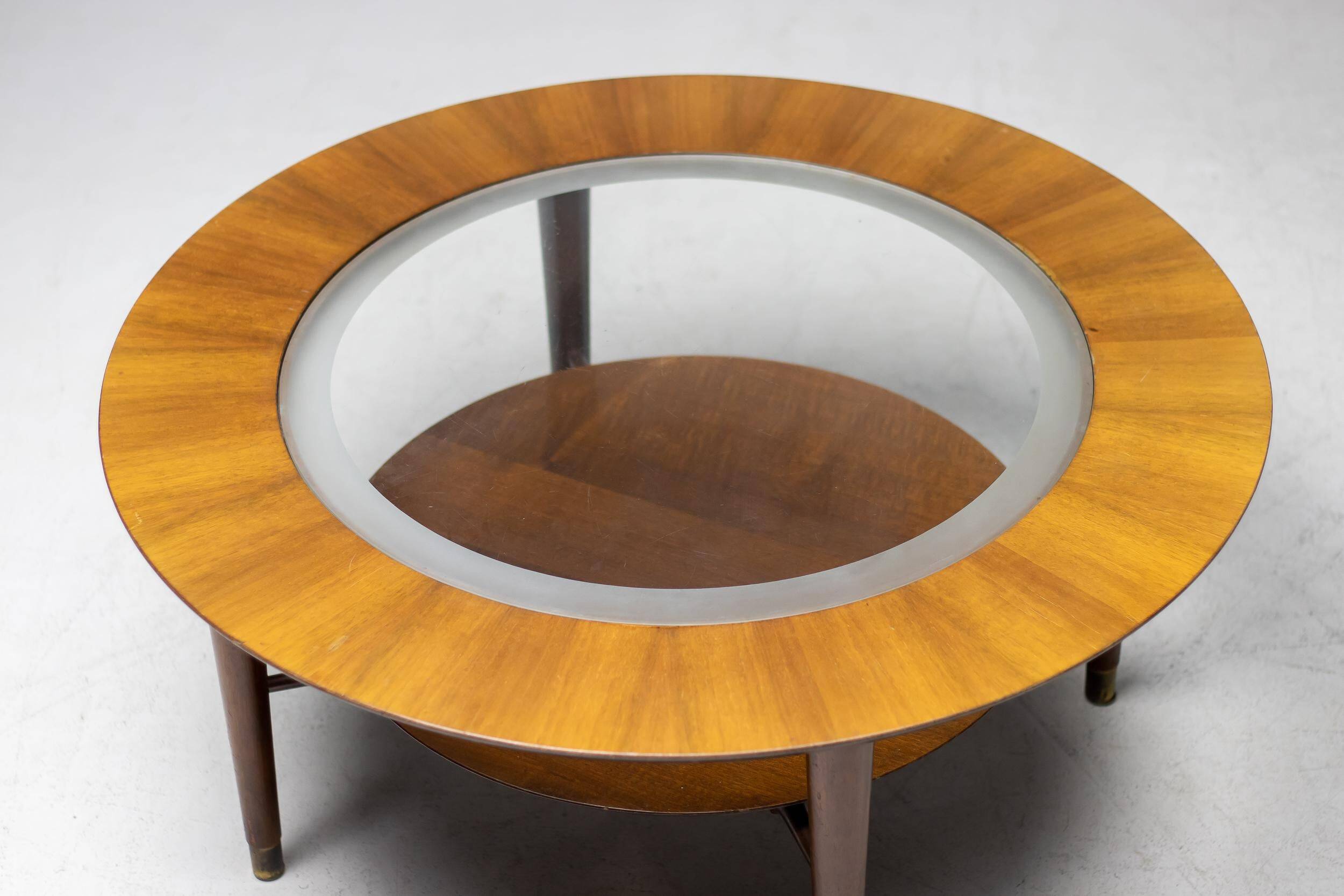 Sculptural coffee table in walnut and glass, Italy, 1950.
