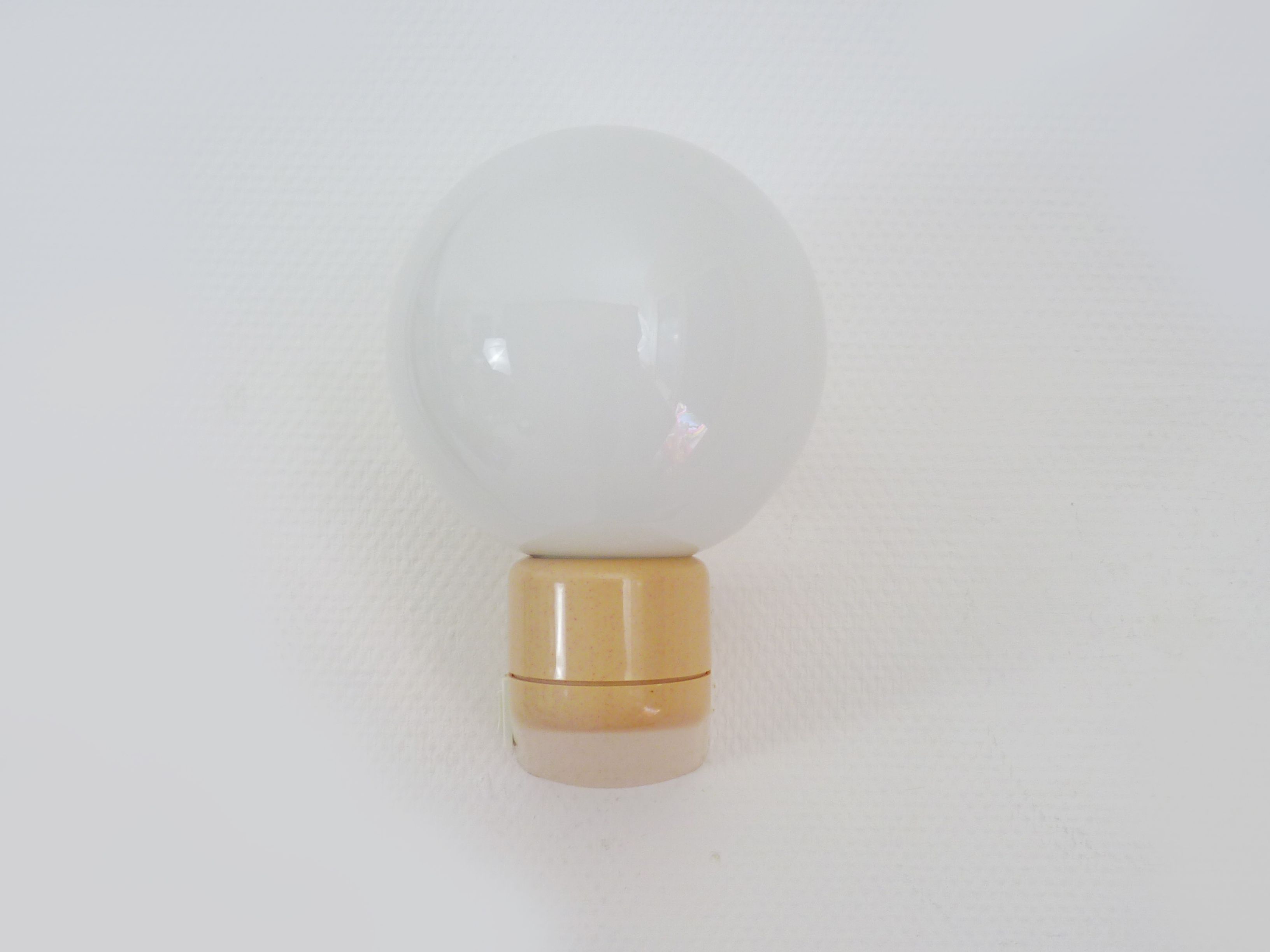 Vintage wall lamp in beige pvc with pink dot and globe in white opaline. Year 70