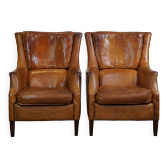 Ensemble de deux fauteuils en cuir de mouton super robustes et très confortables