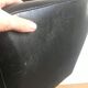 Fauteuil de bureau roulettes et skaï noir vers 1970