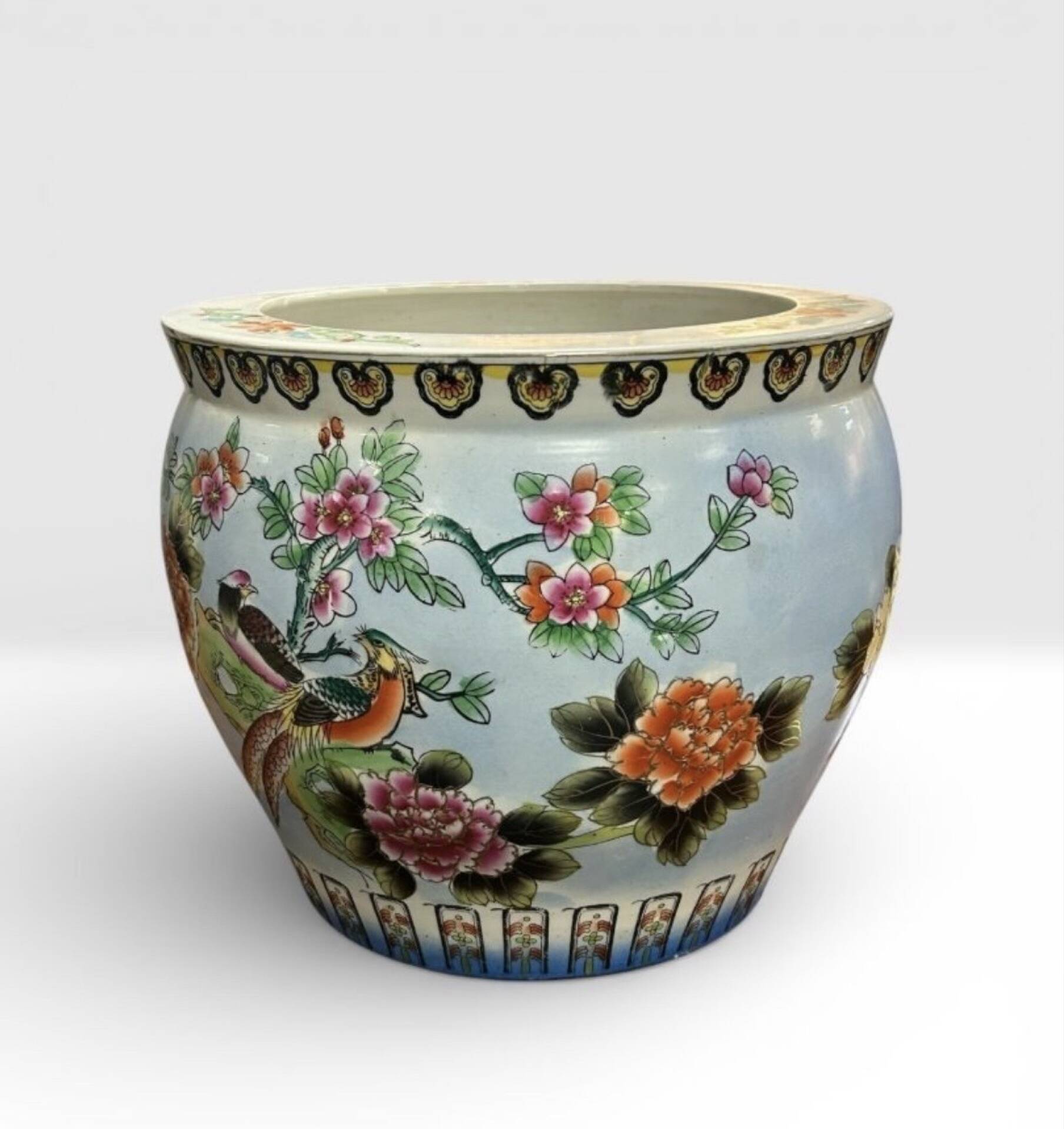 Antique porcelain vase with floral and bird decoration.