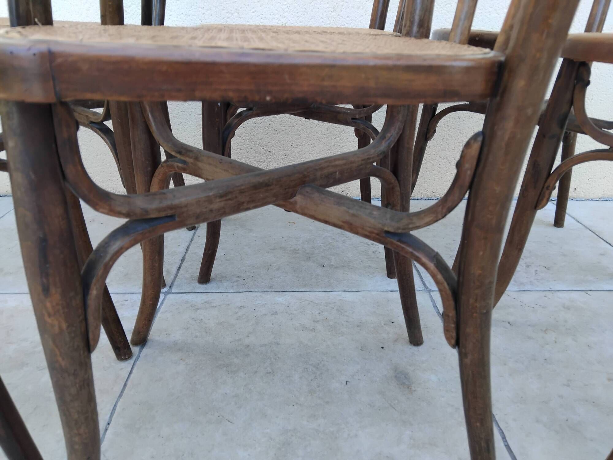 6 antique bistro chairs with curved wood and caning from 1900 L&H Cambier Frères
