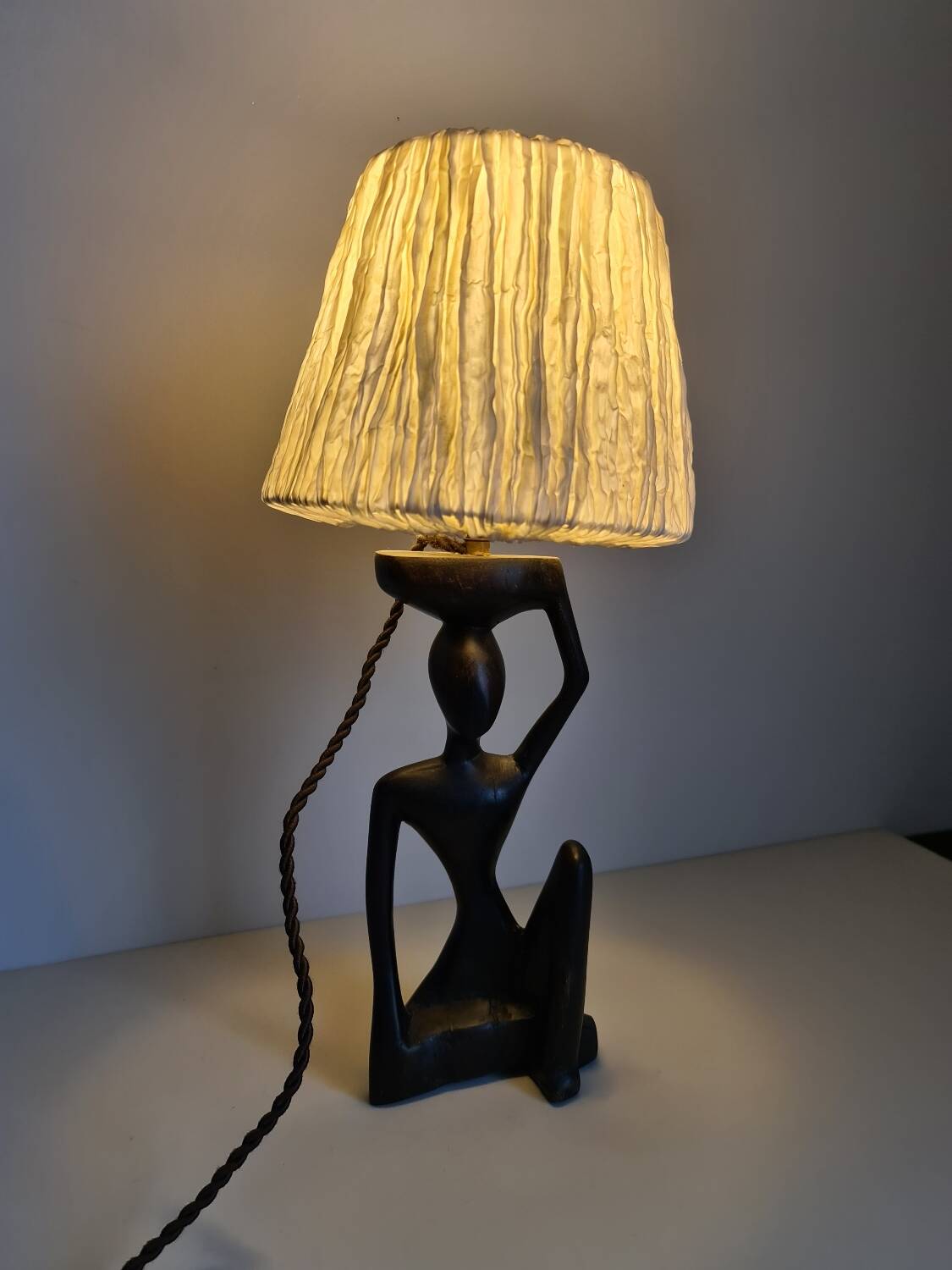 Ebony lamp with seated woman / 1930s