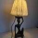 Ebony lamp with seated woman / 1930s