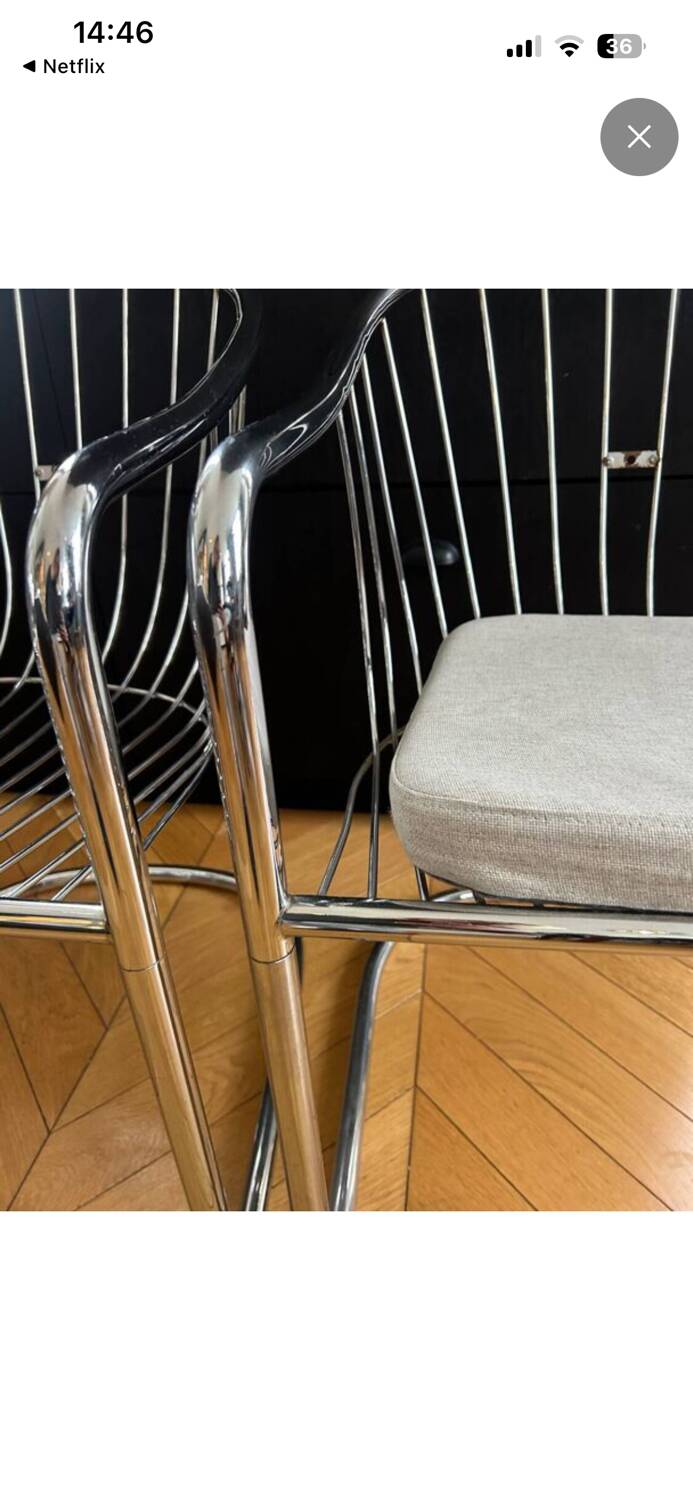 6 chrome metal chairs in the style of Gastonne Ronaldo.